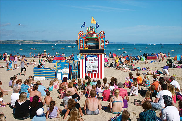Weymouth beach scene, with a Punch and Judy Show and audience