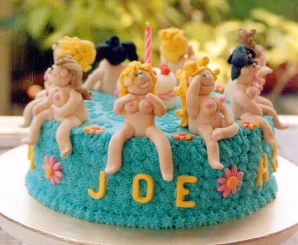 Colourful cake decoration featuring some attractive (and no doubt very sweet) nubile girls.