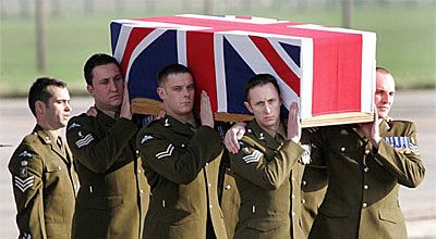 British military personnel carry the coffin of one of 10 Royal Air Force servicemen repatriated in Wiltshire, south-western England. The 10 were killed while serving in Iraq.