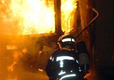 A French fireman tackles a fire during the 2005 French riots