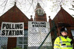 A policeman outside a polling station in Bordesley Green, Birmingham, May 2006