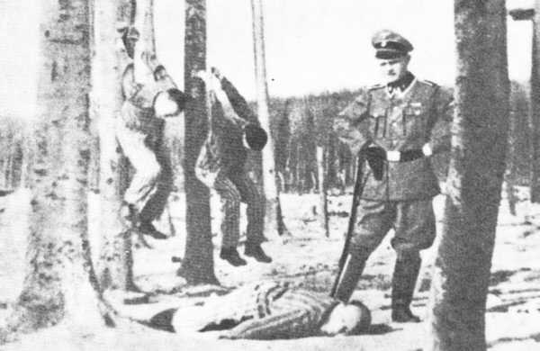 Fake photograph of an KZ guard (in completely inappropriate uniform) and three prisoners being mistreated